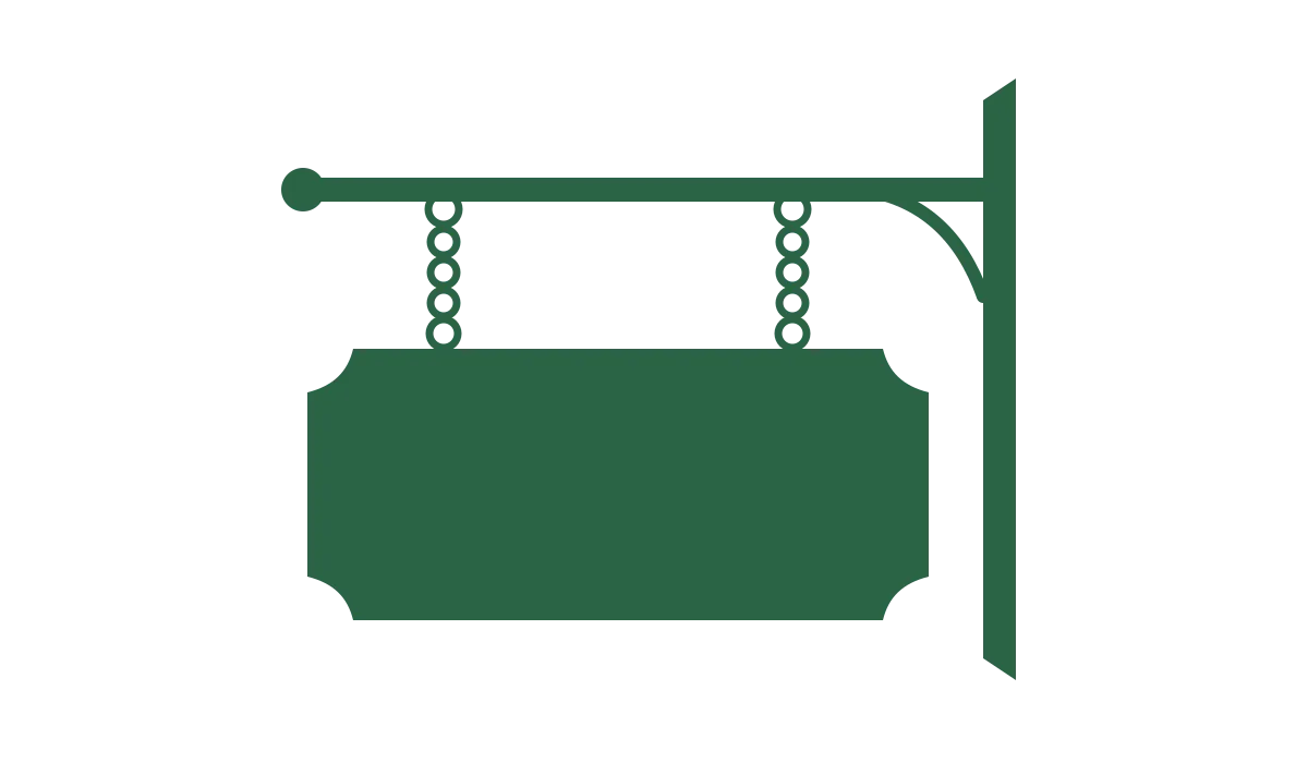 A blank green shop sign hanging from a wall bracket.